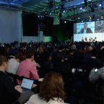 TechCrunch Disrupt 2023 crowd sitting at the Disrupt Stage