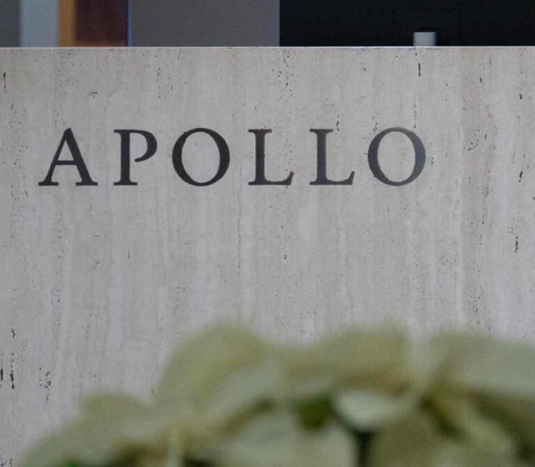Apollo Global Management signage in New York, US, on Tuesday, Dec. 5, 2023. Apollo's CEO said it's getting harder for active managers to beat indexes in public markets and that it is easier for investors to find alpha in private markets. Photographer: Jeenah Moon/Bloomberg via Getty Images