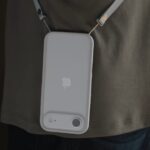 iPhone hanging from Apple Crossbody Strap