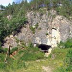 Entrance to Denisova Cave in Siberia, Russia, where Denisovans were first identified. New discoveries in China are adding important details to our understanding of these prehistoric humans.