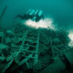 Divers swim over the wrecks of the HMS Tiger.