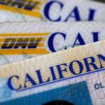 In this photo illustration, the California Department of Motor Vehicles (DMV) logo appears on a California driver license.