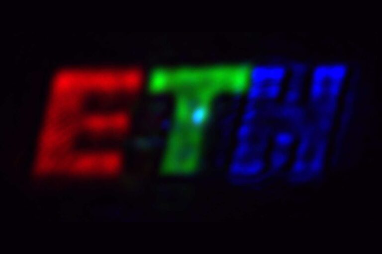 The colored logo was created using the new ETH researchers‘ Fourier pixels. The letter “E” is roughly 1 millimeter tall on the camera.