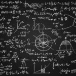 Image of math equations written on a blackboard.