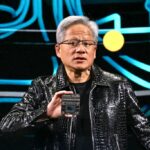 Jensen Huang holds up chip at CES 2025
