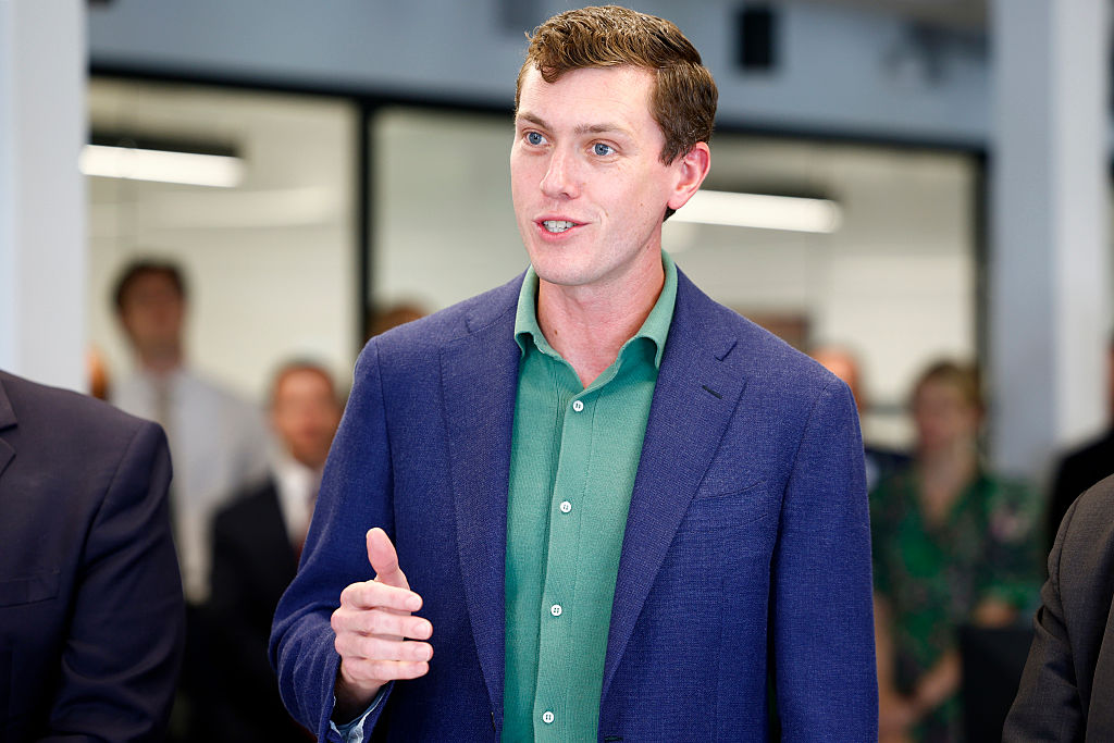 Garrett Langley, CEO and co-founder of Flock Safety, speaks during a ribbon cutting for the Seaport District headquarters on July 22, 2025.