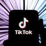 A smartphone displays the TikTok logo.