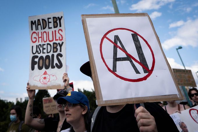 gettyimages-2283113936-maller A sign opposed to AI is held during a protest against AI data centers in Vancouver, British Columbia, Canada, on Saturday, June 27, 2026. Canadians aren't universally sold on building sovereign compute, with early signs of protest against AI server farms in British Columbia and Manitoba. Photographer: Ethan Cairns/Bloomberg via Getty Images