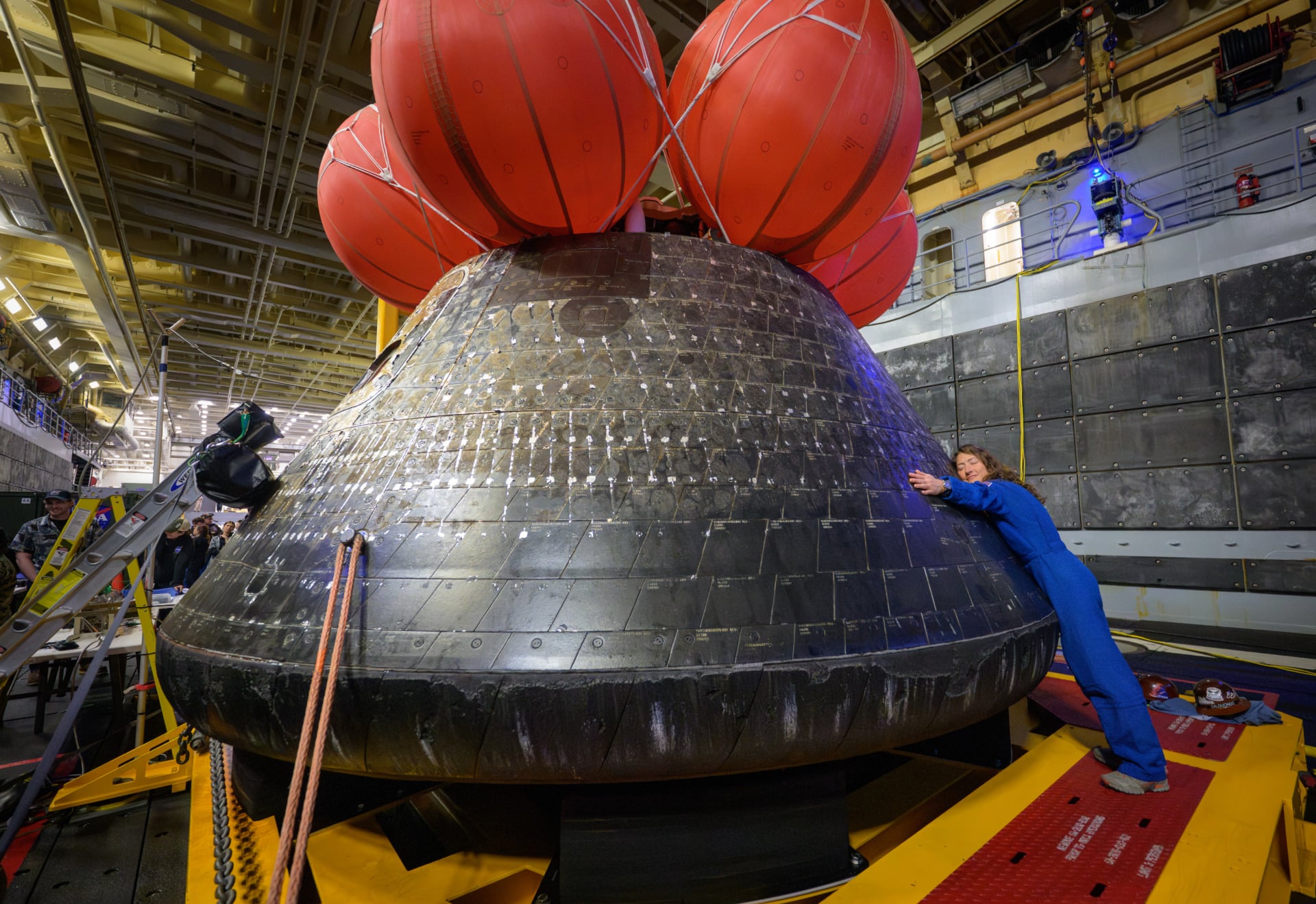 gsf-artemis-2-image-5 Christina Koch hugging the Orion capsule after splashdown