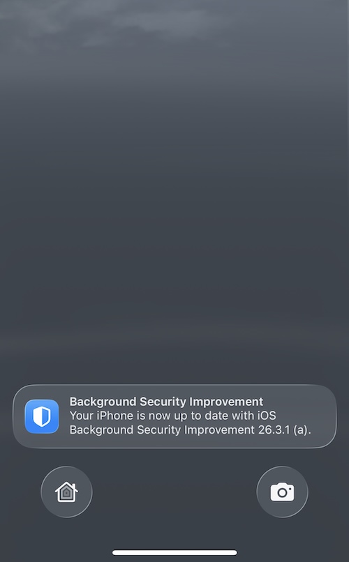 img_3720 a screenshot showing an iPhone home/lock screen after a restart. A notification reads: "Background Security Improvement Your iPhone is now up to date with ioS Background Security Improvement 26.3.1 (a)."