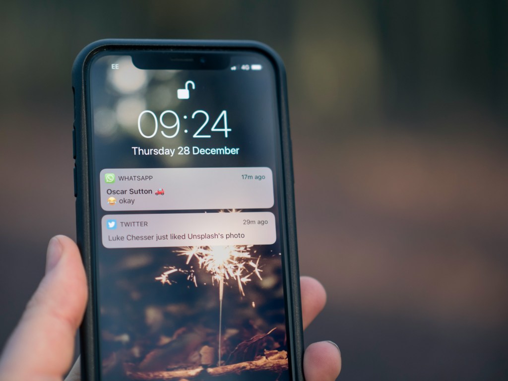 A picture showing an iPhone and two pop-up notifications.