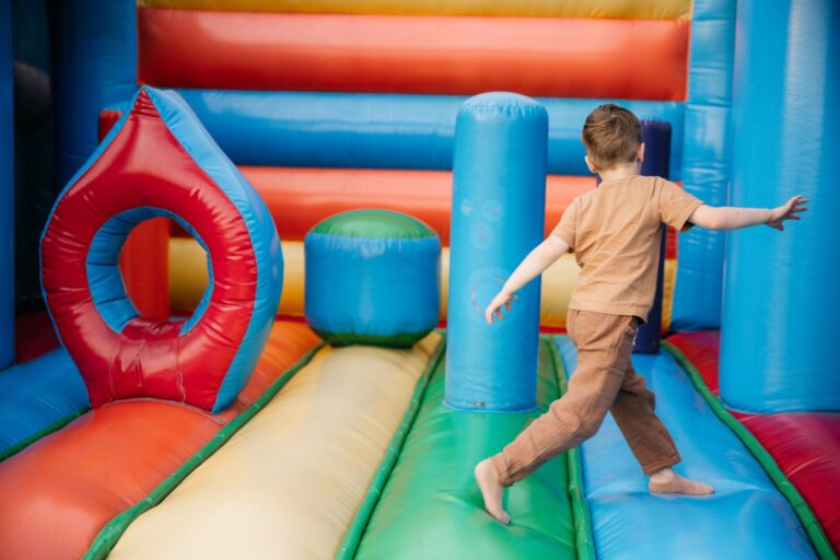 A child playing in a bounce house.