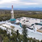 A geothermal drilling rig sits in a forest in Oregon.