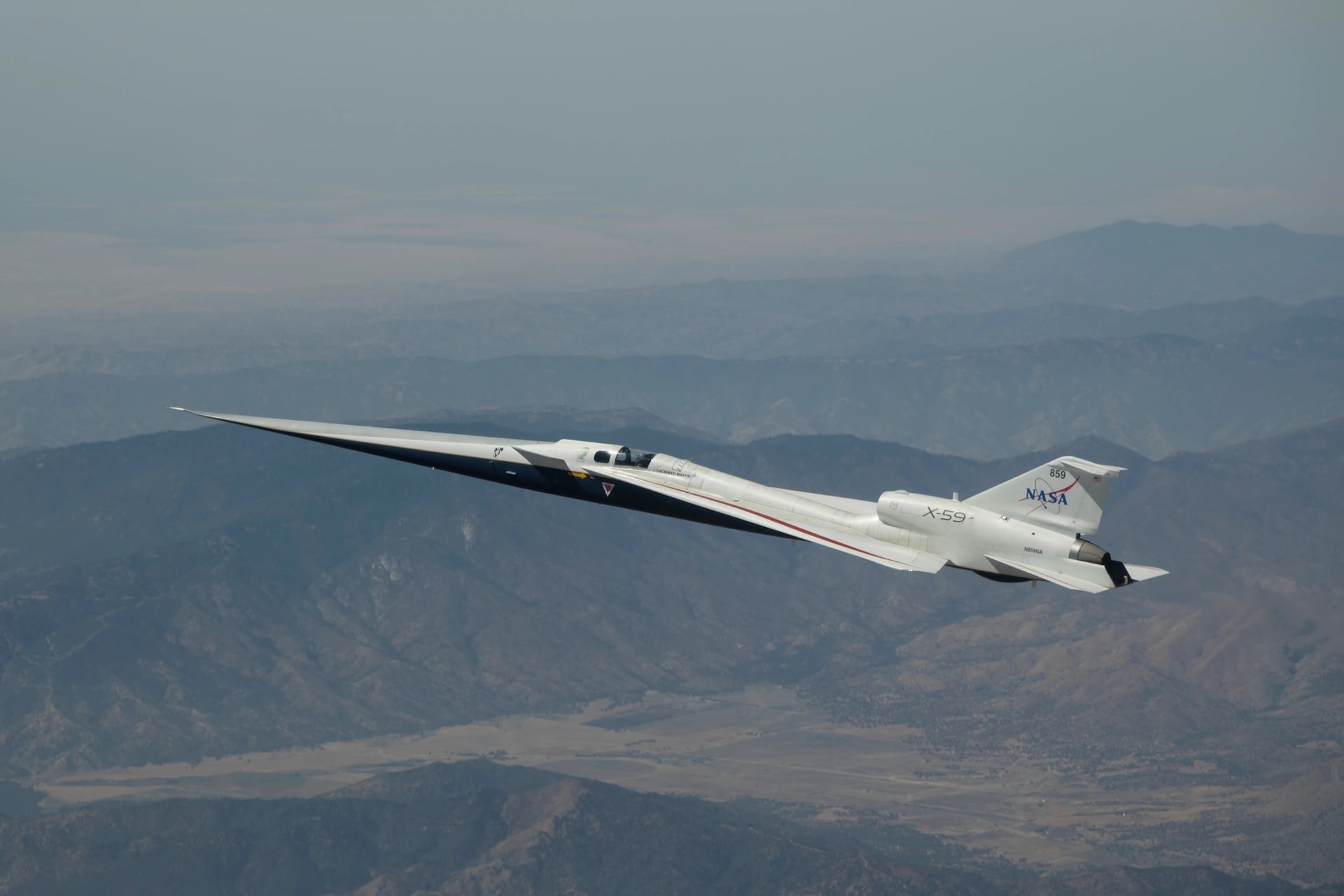 NASA’s X-59 quiet supersonic research aircraft flies above the Mojave Desert in California on Tuesday, Aug. 18, 2026.