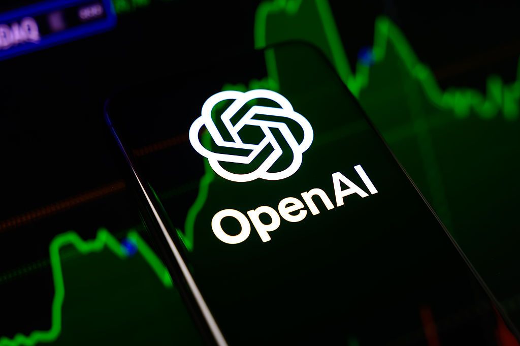 The OpenAI logo is displayed on a smartphone screen