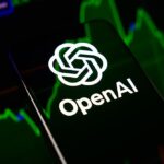 The OpenAI logo is displayed on a smartphone screen
