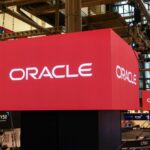 Oracle Corp. signage on the floor of the New York Stock Exchange (NYSE) in New York, US, on Friday, April 10, 2026.