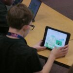person looking at ASL Aspire screen