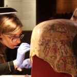 Clara Granzotto taking a micro-sample for proteomics analysis from the painted surface of Mummy mask of a woman.