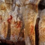 La Pasiega, section C, cave wall with paintings. The red vertical and horizontal lines date back 64,000 years, and were almost certainly painted by Neanderthals.