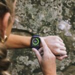 woman checking her smartwatch