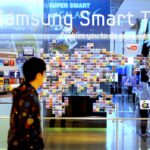 A South Korean man walks past a Samsung smart TV advertisement at a showroom in Seoul on January 28, 2011. Samsung Electronics said fourth-quarter net profit 3.42 trillion won ($3.07 billion), but forecast a challenging few months ahead after a record-setting year. AFP PHOTO / PARK JI-HWAN (Photo credit should read PARK JI-HWAN/AFP via Getty Images)
