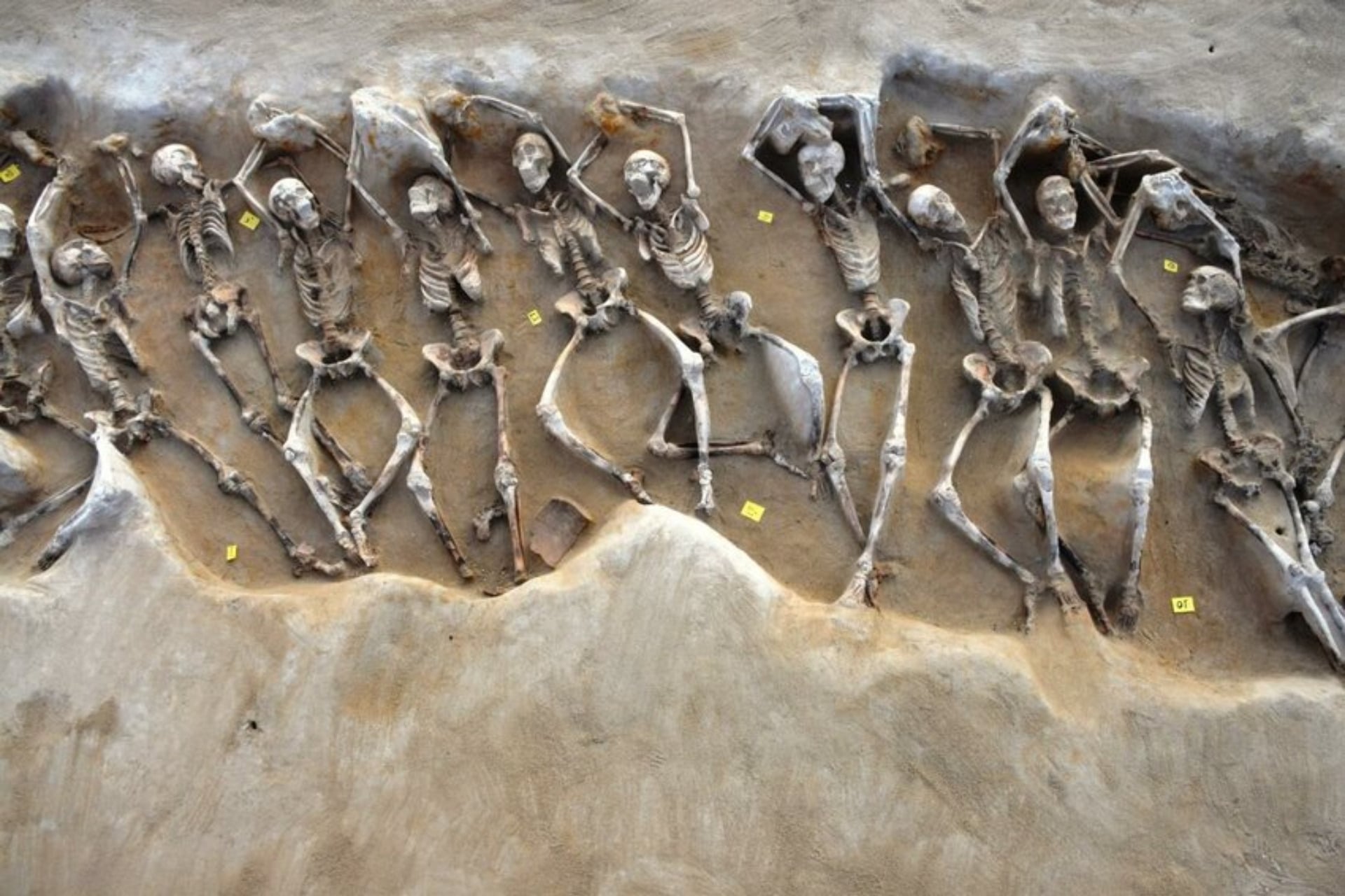 Many men were discovered with their hands shackled.