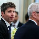 Sam Altman, chief executive officer of OpenAI Inc., left, and Tim Cook, chief executive officer of Apple Inc.