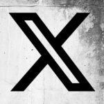 X (formerly Twitter) logo on a cracked wall