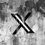 X (formerly Twitter) logo on a cracked wall