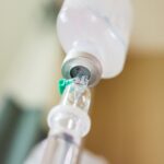 Close Up Medical Intravenous Iv Drip In Hospital Background