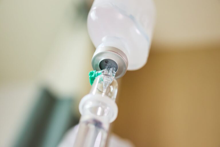 Close Up Medical Intravenous Iv Drip In Hospital Background
