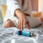 A woman reaching for an asthma inhaler.