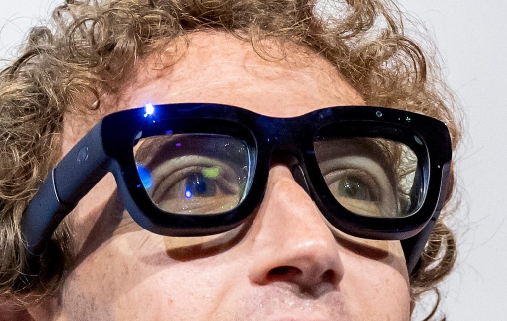 Mark Zuckerberg, chief executive officer of Meta Platforms Inc., wears Orion augmented reality (AR) glasses during the Meta Connect event in Menlo Park, California, US, on Wednesday, Sept. 25, 2024. Meta Platforms Inc. debuted its first pair of augmented reality glasses, devices that show a combined view of the digital and physical worlds, a key step in Chief Executive Officer Mark Zuckerberg's goal of one day offering a hands-free alternative to the smartphone. Photographer: David Paul Morris/Bloomberg via Getty Images