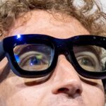 Mark Zuckerberg, chief executive officer of Meta Platforms Inc., wears Orion augmented reality (AR) glasses during the Meta Connect event in Menlo Park, California, US, on Wednesday, Sept. 25, 2024. Meta Platforms Inc. debuted its first pair of augmented reality glasses, devices that show a combined view of the digital and physical worlds, a key step in Chief Executive Officer Mark Zuckerberg's goal of one day offering a hands-free alternative to the smartphone. Photographer: David Paul Morris/Bloomberg via Getty Images