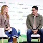 SAN FRANCISCO, CALIFORNIA - OCTOBER 13: (L-R) Kirsten Korosec and RJ Scaringe, Founder & CEO, Rivian, speak onstage during TechCrunch Disrupt 2026 at Moscone Center on October 13, 2026 in San Francisco, California. (Photo by Kimberly White/Getty Images for TechCrunch)