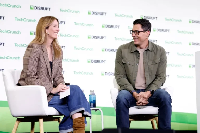 SAN FRANCISCO, CALIFORNIA - OCTOBER 13: (L-R) Kirsten Korosec and RJ Scaringe, Founder & CEO, Rivian, speak onstage during TechCrunch Disrupt 2026 at Moscone Center on October 13, 2026 in San Francisco, California. (Photo by Kimberly White/Getty Images for TechCrunch)