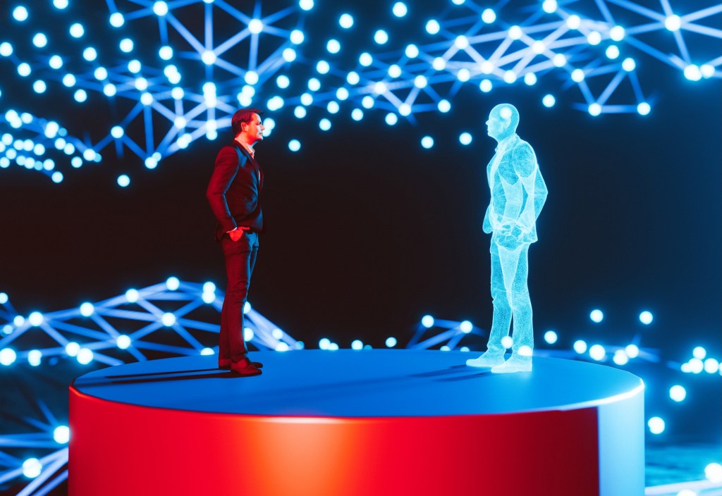 Man standing on a red platform, facing a holographic digital twin of himself. The background features a network of interconnected blue lights, creating a futuristic and high-tech atmosphere. The scene represents concepts of digital twins, virtual reality, and advanced technology.