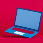 Blue laptop on a red background