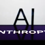 AI sign displayed on a screen and Anthropic logo displayed on a phone screen are seen in this illustration photo.