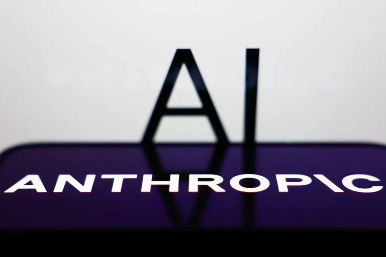 AI sign displayed on a screen and Anthropic logo displayed on a phone screen are seen in this illustration photo.