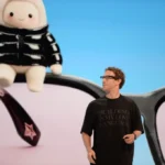 Mark Zuckerberg, CEO of the Facebook parent company Meta, takes the stage at the Meta Connect developer conference. Behind him is a personalized mascot of the AI assistant Muse.