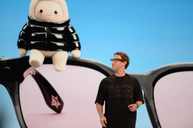 Mark Zuckerberg, CEO of the Facebook parent company Meta, takes the stage at the Meta Connect developer conference. Behind him is a personalized mascot of the AI assistant Muse.