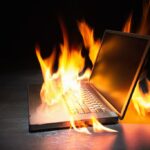 Laptop computer engulfed in flames