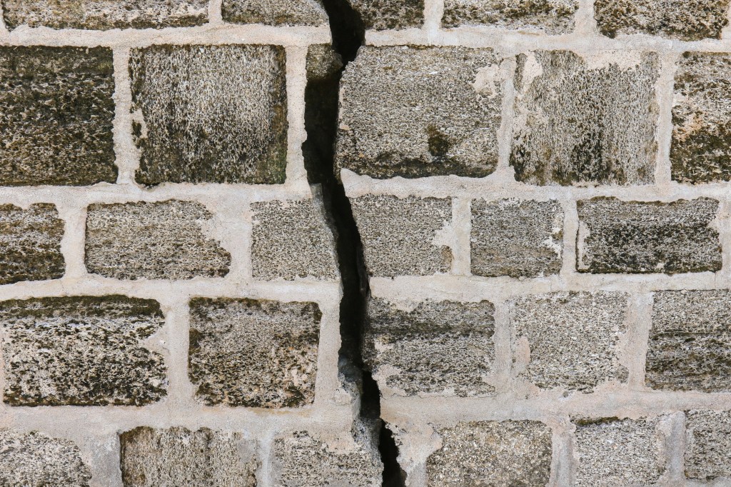 big crack in brick wall