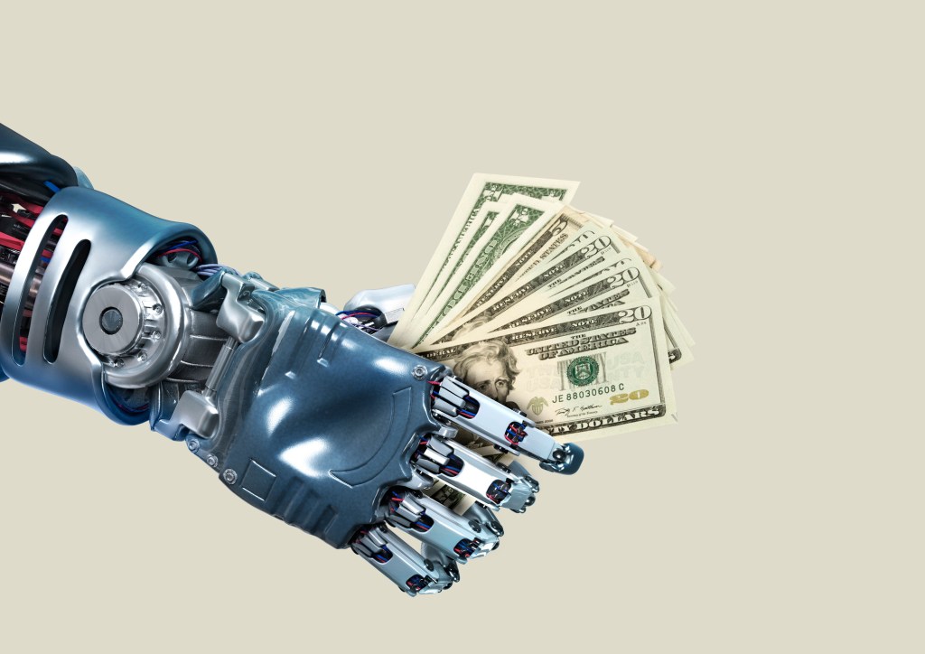 Robot hand holding lots of cash